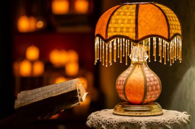 table lamp space for text book space for text  dark bedroom luxury orange  Old fashion night light Vintage Mood Retro Against Wall candle background.