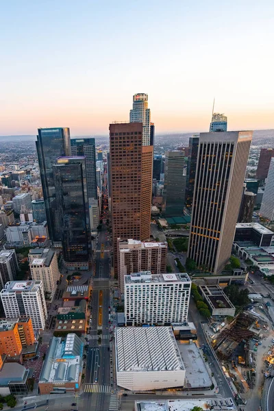 The downtown Los Angeles California and the city traffic at dusk. Picture taken from a helicopter after the sunset