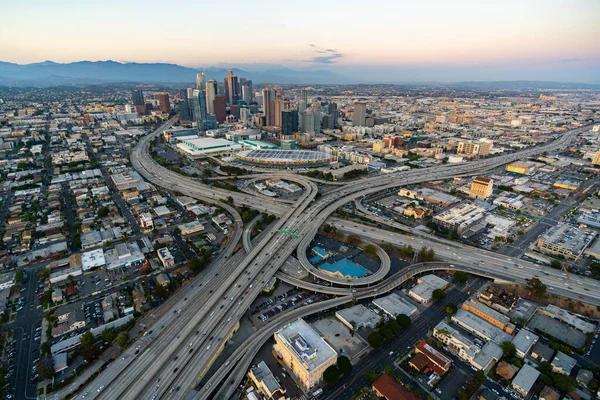 The downtown Los Angeles California and the city traffic at dusk. Picture taken from a helicopter after the sunset