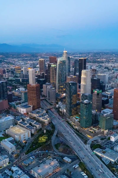 The downtown Los Angeles California and the city traffic at dusk. Picture taken from a helicopter after the sunset