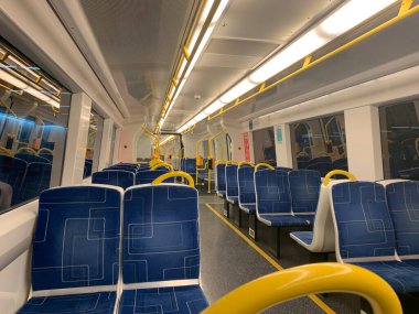 Metro trains stop at the railway platform in Adelaide. High quality photo