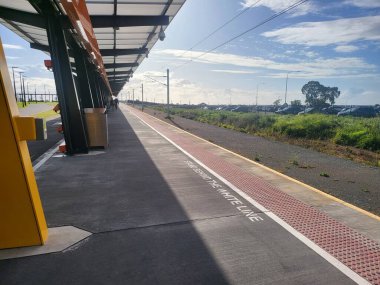 Metro trains stop at the railway platform in Adelaide. High quality photo