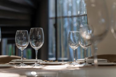 Beautiful table setting with glasses, plates and napkins-2. Clouse-up.