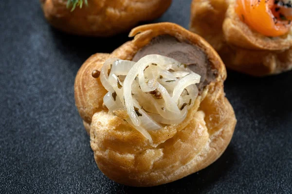 Fresh golden profiterole with pate. Gourmet cuisine, decorated with onions. — 스톡 사진