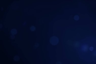 Arkaplanı dekore etmek için kullanılan koyu mavi arkaplan bokeh resmi.