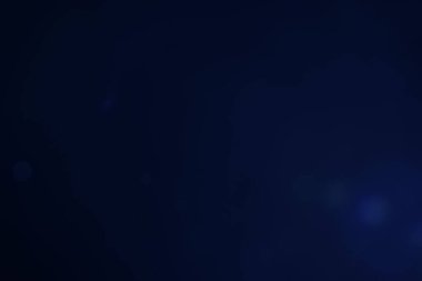 Arkaplanı dekore etmek için kullanılan koyu mavi arkaplan bokeh resmi.