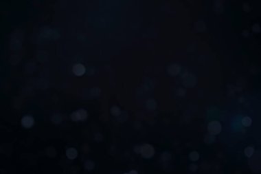 Arkaplanı dekore etmek için kullanılan koyu mavi arkaplan bokeh resmi.