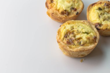 Mini quiche with bacon and herbs - selective focus