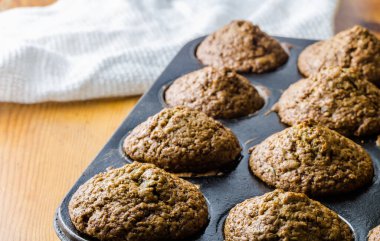 Muffins in baking tray out of oven with copy space - selective focus image