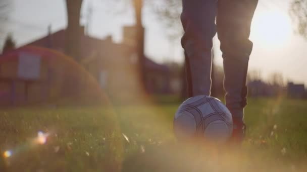 A boy plays soccer with a ball. — 图库视频影像