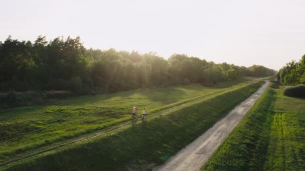 Two Girl Girlfriends Riding Bicycles Park Sunset Beautiful Nature Active — Stock Video