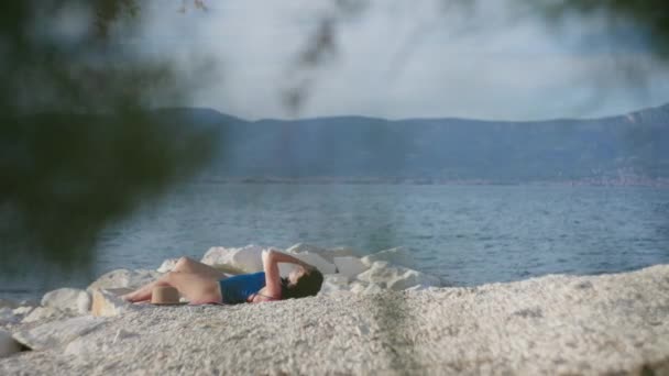 Girl Sunbathes Birches Sea Woman Lying Beach Relaxing Beautiful Landscape — Stockvideo