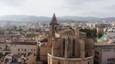 Architecture of the old town with cathedrals dron 4K video. Aerial view of the city center with historic houses, churches and their roofs in Palma Spain. High quality 4k footage
