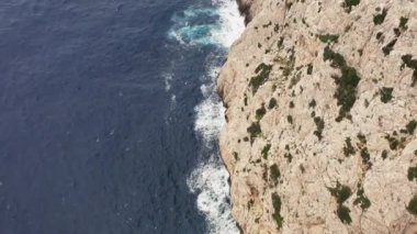 landscape of rocks and ocean dron 4K video. Aerial view Ocean waves crashing against a mountain and reefs, rock. High quality 4k footage