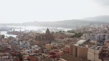 Old town in Palma on the island of Mallorca Spain dron 4K video. Aerial view of historic streets with houses, Mediterranean seafront church with beautiful urban landscape. High quality 4k footage