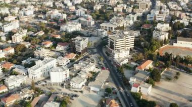 Aerial view Paphos Cyprus. Drone flight over the central part of the historic and tourist city with streets, roads, houses, hotels. Beautiful urban cityscape. High quality 4k footage