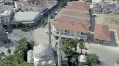 Drone video of urban cityscape with houses, roofs, streets and roads on them in an Asian city on the Mediterranean. Aerial view Antalya Turkey. High quality 4k footage