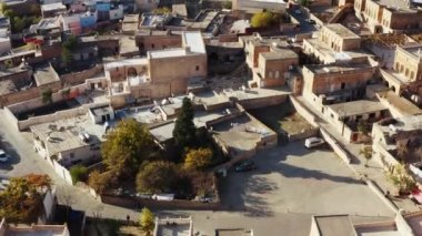 Drone video of urban urban landscape in the Middle East. Houses with roofs and streets with historic neighborhoods in the city on the mountain. Aerial view Mardin Turkey. High quality 4k footage