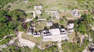 Drone video of the ancient historic Mayan city. Pyramids and temples of the ancient people by the sea at the site of archaeological excavations. Aerial view Tulum Mexico. High quality 4k footage