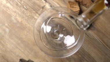 Pouring cognac into a glass. Alcohol poured into a glass splashes. Beautiful composition with brandy shot in 4K slow motion. High quality 4k footage