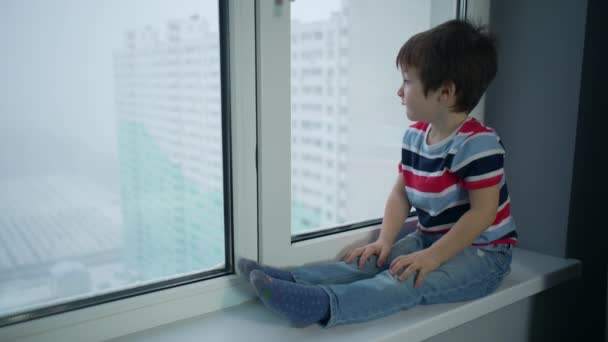 Boy Sits Windowsill Looks Out Window Quarantine Times Children Sit — Stockvideo