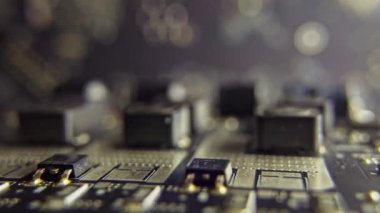 Macro video of a motherboard with a processor. High latest technologies with boards and connections on them.