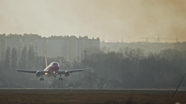 Plane Lands Runway Sunset Airplane Touches Wheels Earth Smoke Appears — Vídeos de Stock