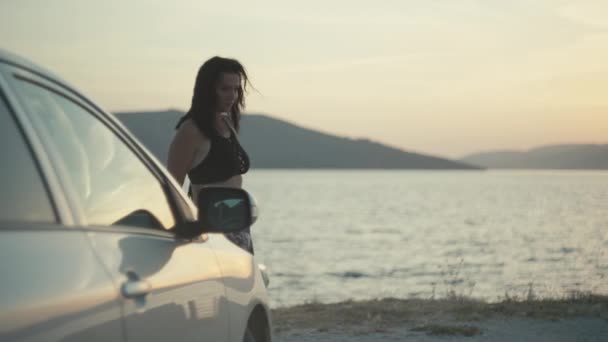 Woman Watching Sunset Sea Leaning Car Traveling Car Ocean Beautiful — Video