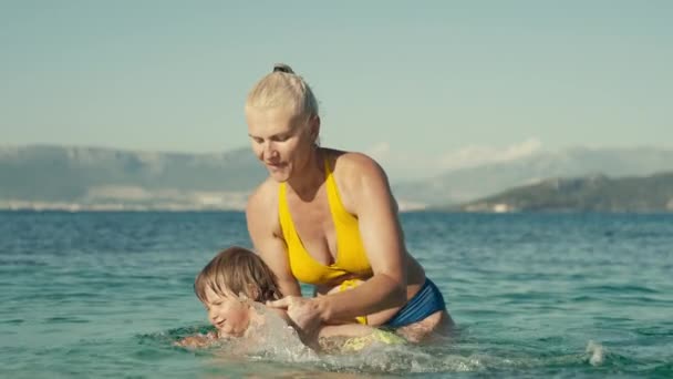 Slow Motion Video Grandmother Granddaughter Swimming Sea Together Woman Baby — Video