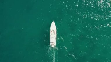 Aerial view The boat is sailing on the ocean. A fast boat sails in the blue water of the Indian Ocean. High quality 4k footage
