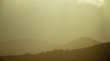 Stluet landscape of mountain ranges at sunset. Nature landscape background video. High quality 4k footage