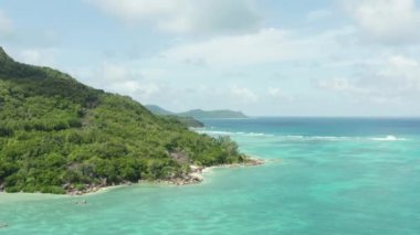 Aerial view of Seychelles. The nature of islands in the Indian Ocean. Mountains, beaches, rocks on the ocean shore in an exotic location. High quality 4k footage