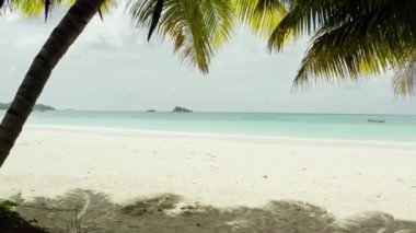 Aerial view of Seychelles beach. A beautiful sandy beach on the shores of the Indian Ocean. The nature of the equator with blue water and bounty beaches. High quality 4k footage