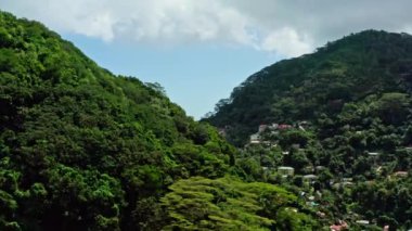 Aerial view of the island of Mahe, Seychelles. Beautiful landscape of mountains with jungle and nature on an island near the Indian Ocean. Exotic luxury vacation. High quality 4k footage