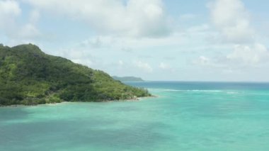 Aerial view of Seychelles. Coastline with mountain and jungle on an island in the Indian Ocean. High quality 4k footage