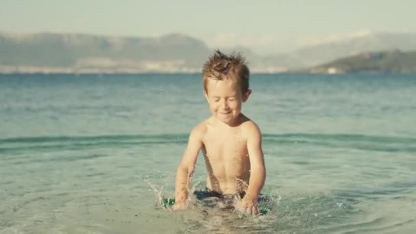 Slow Motion Video Cheerful Boy Swimming Splashing Water Ocean Child — 비디오