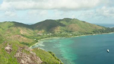 Aerial view of the mountains on the Seychelles islands. Beautiful tropical exotic nature. Jungle on the slopes of mountain ranges. Indian Ocean. High quality 4k footage