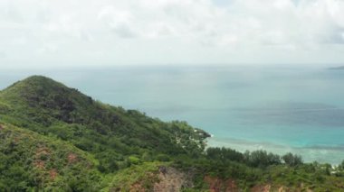 Aerial view nature of Seychelles. The mountains on the islands are covered with jungle on the shores of the Indian Ocean at the equator. High quality 4k footage