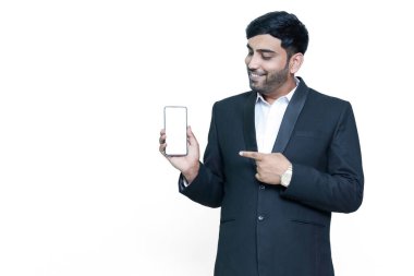 Pointing mobile blank screen in suit male model.