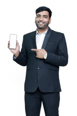 Pointing mobile blank screen in suit male model