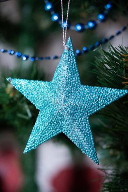 New Year's toys hang on the Christmas tree. 2022