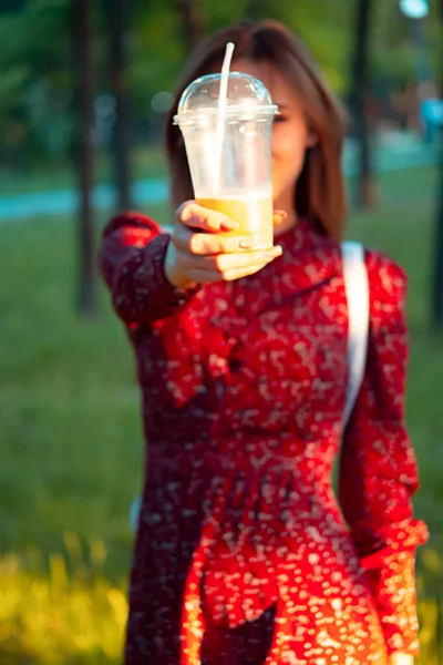 Woman Walking Park She Drinks Coffee Cup Stunning Sunset Background — Stockfoto