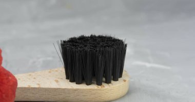 Close-up of a wooden brush for anti-cellulite dry body massage