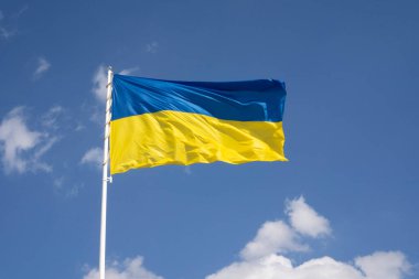 Flag of Ukraine on a blue sky background
