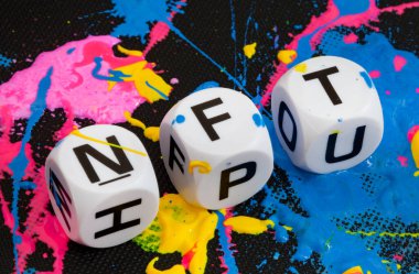 NFT in letter dice with paint splatters in multiple colors clipart