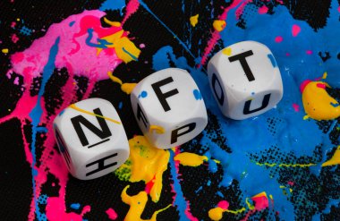 NFT in letter dice with paint splatters in multiple colors clipart