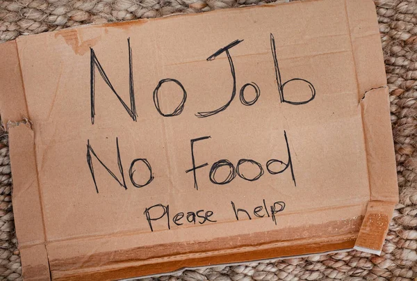 cardboard sign from someone begging for food
