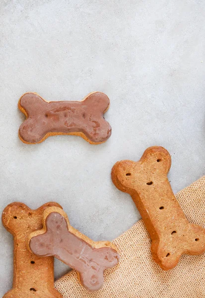 dog treats on neutral rustic background with copy space