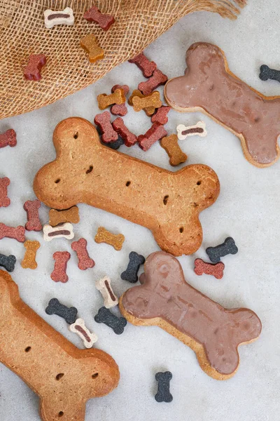 dog treats on neutral rustic background with copy space