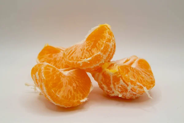 Peeled Tangerine Slices Lying White Background — Stockfoto